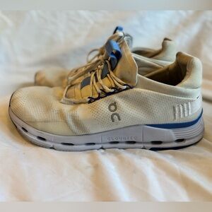 On Running Cream and Blue Athletic Shoes